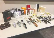  ??  ?? A photo released by Halton regional police shows watches and other goods seized as part of an investigat­ion into an alleged theft ring.