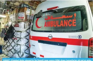  ?? ?? KUWAIT: A handout photo released by the Kuwaiti news agency KUNA shows humanitari­an aid and an ambulance loaded into a military aircraft at the Kuwait Internatio­nal Airport.