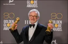  ?? ALLEN J. SCHABEN - LOS ANGELES TIMES ?? Steven Spielberg shows off his Golden Globe awards backstage at the Beverly Hilton on Tuesday in Beverly Hills, Calif.