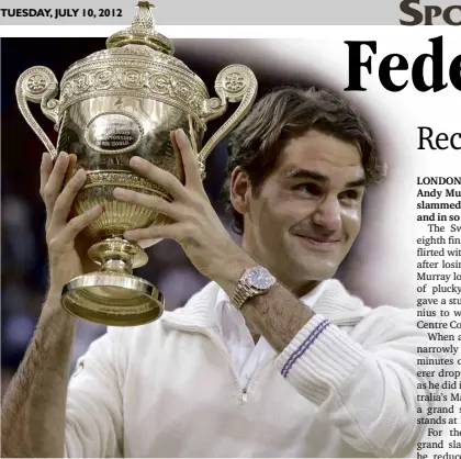  ??  ?? ROGER Federer raises his seventh Wimbledon trophy after stopping local hope Andy Murray.