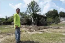  ?? JASON DEAREN — THE ASSOCIATED PRESS ?? In this photo taken in Crosby, Texas, across the San Jacinto River from Houston, Rafael Casas tours his storm ravaged house in a small working-class neighborho­od that sits between two Superfund sites, French LTD and the Sikes Disposal Pits. The area...