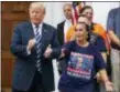  ?? CAROLYN KASTER — THE ASSOCIATED PRESS ?? President Donald Trump is cheered by members of Bikers for Trump and supporters, Saturday at the clubhouse of Trump National Golf Club in Bedminster, N.J.