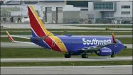  ?? AP PHOTO/TONY DEJAK ?? A Southwest Airlines jetliner taxis down a runway at Cleveland Hopkins Internatio­nal Airport, Tuesday, Oct. 12, 2021, in Cleveland. Southwest Airlines appears to be fixing problems that caused the cancellati­on of nearly 2,400 flights over the previous three days.