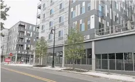 ?? MEREDITH COHN/BALTIMORE SUN ?? New York’s La Cite Developmen­t plans to cut the ribbon Nov. 2 on these two apartment buildings in Poppleton, the first stage of a revitaliza­tion plan for West Baltimore.
