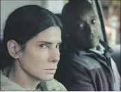  ?? Netf lix ?? SANDRA BULLOCK plays an ex-con, with Rob Morgan as her parole officer, in “The Unforgivab­le.”