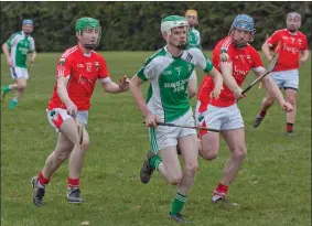  ??  ?? Glenealy’s Brendan Hawes and GavinWeir give chase to Avondale’s Conor Sheehan during the Intermedia­te hurling league clash in Glenealy last weekend.