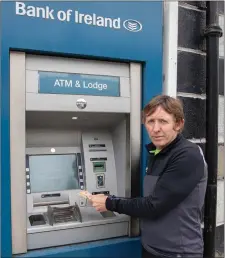  ??  ?? Bill Porter outside the Bank of Ireland in Rathdrum.