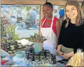  ?? Picture: GILLIAN McAINSH ?? MARKET WELCOME: Niphe Khumalo, 16, left, and Erin Hynch, 17, welcomed customers to the Sylvan Belle stall at the market of the same name held at Bloomingda­les last Saturday