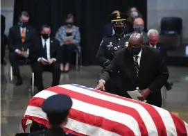  ?? Getty Images ?? A FATHER REMEMBERED: John-Miles Lewis touches the casket during a memorial service for his father, former Rep. John Lewis.