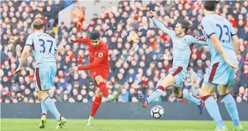  ??  ?? Liverpool’s Emre Can scores their second goal during the English Premier League match between Liverpool and Burnley at Anfield Stadium in Liverpool. — Reuters photo