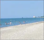  ?? ANDREW CASS - THE NEWS-HERALD ?? People enjoy Lake Erie on a hot day July 9 at Headlands Beach State Park in Mentor.