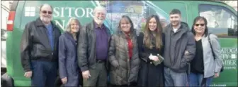  ?? LAUREN HALLIGAN — MEDIANEWS GROUP ?? Digital marketing strategist Amberly Bucci, third from right, is surrounded by family during a ribbon cutting event for the launch of her new business on Monday with the Saratoga County Chamber of Commerce.