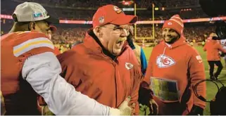  ?? REED HOFFMANN/AP ?? Chiefs coach Andy Reid, center, celebrates with defensive end Frank Clark, left, after they beat the Bengals in the AFC championsh­ip game on Sunday in Kansas City, Missouri.