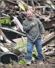  ?? Lori Van Buren / times union ?? danny ditonno, of ditonno & Sons, descends from a pile of rubble at 865 myrtle Ave. in Albany as neighbors applaud the crew’s efforts.