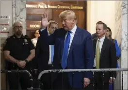  ?? YUKI IWAMURA – THE ASSOCIATED PRESS ?? Former President Donald Trump gestures to onlookers as he exits the courtroom in his civil business fraud trial at New York Supreme Court on Wednesday.