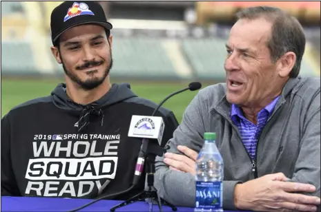  ?? DENVER POST FILE ?? Rockies owner Dick Monfort, shown with third baseman Nolan Arenado in 2019, is a cautious businessma­n not inclined to spend like the Padres billionair­e owner and chairman Peter Seidler.