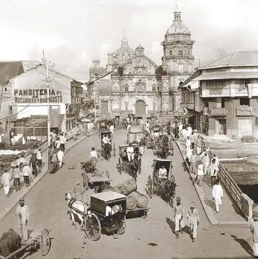  ??  ?? View of Binondo Church and Panciteria Macanista de Buen Gusto from across San Fernando Bridge, c. 1899the “Bond Street” of Manila