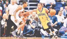  ?? — AFP photo ?? Joe Young (right) of the Indiana Pacers controls the ball under pressure from Brandon Knight of the Phoenix Suns during the first half of the NBA game at Talking Stick Resort Arena in Phoenix, Arizona in this Jan 19, 2016 file photo.