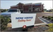  ?? ROGELIO V. SOLIS — THE ASSOCIATED PRESS FILE ?? This help wanted sign is displayed at a new Zaxby’s restaurant in Madison, Miss.