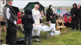  ?? Photo by Kathryn Crowley ?? Fr Jim Sheehy celebratin­g Mass in the cillín at Knockeen, Ballintagg­art, on Thursday last.