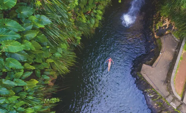  ??  ?? Get away from it all: take a refreshing swim in the waterfalls at St George’s, Grenada’s capital. The town is surrounded by part of an old volcano crater