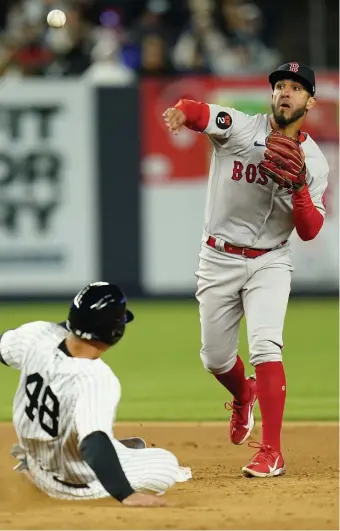  ?? Ap ?? TURN TWO: Jonathan Arauz, right, throws out New York Yankees' Aaron Judge at first base after forcing out Anthony Rizzo, left, for a double play during the fourth inning of last night’s 4-3 win
.