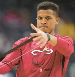  ?? ZALUBOWSKI/AP DAVID ?? At the moment, it is not thumbs up for sidelined Heat center Orlando Robinson.