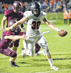  ?? OKLAHOMAN] [PHOTO BY TYLER DRABEK, FOR THE ?? Crescent’s Hunter Bowers breaks a tackle while running into the end zone during Friday’s game against Cashion High School.