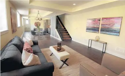  ??  ?? Foxwell added paintings by local artist Kelly L. Walker to this home he staged on South Highland Avenue to create an inviting space in which buyers could see themselves living. “I’m just in there to make things look good and I’m out," Foxwell says.