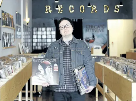  ?? HARLEY DAVIDSON / SPECIAL TO NIAGARA FALLS REVIEW ?? Mindbomb Records owner Chris Charkowy with some of the releases coming out for Record Store Day on Saturday.