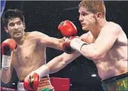  ?? PTI PHOTO ?? Vijender Singh (left), bronze medallist at the Beijing Olympics in 2008, has made a successful foray into profession­al boxing.