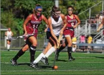  ?? BILL RUDICK — FOR DIGITAL FIRST MEDIA ?? Downingtow­n West’s Ciana Riccardo is chased by Henderson’s Lexi Dunleavy and Ming Doherty during a game Thursday.