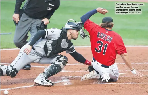  ?? RON SCHWANE/AP ?? The Indians’ Josh Naylor scores past Sox catcher Yasmani Grandal in the second inning Monday night.