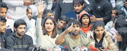  ?? ANI ?? Tokyo Olympics silver medallist Ravi Dahiya, Vinesh Phogat, Bajrang Punia and Sakshi Malik address a press conference during their second day of protest against the Wrestling Federation of India (WFI) and its chief Brij Bhushan Sharan Singh, at Jantar Mantar, in New Delhi on Thursday.