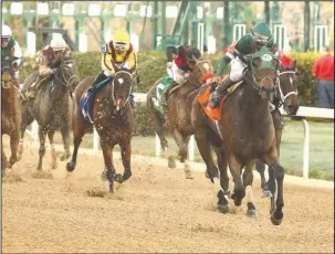  ?? The Sentinel-Record/Richard Rasmussen ?? GETTING BETTER: Jockey Paco Lopez rides Martini Glass across the wire to win the Grade 2 $350,000 Azeri Stakes for older fillies and mares at Oaklawn Park Saturday.