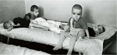  ??  ?? Above and below Thousands of children were placed in Romanian orphanages during the Ceausescu regime