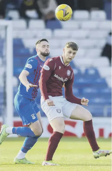  ?? ?? 0 Arbroath striker Jack Hamilton, right, battles for the ball with Inverness defender Danny Devine