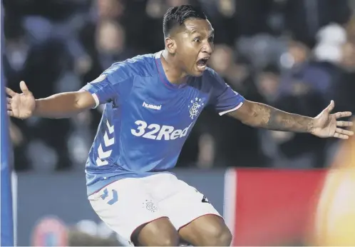  ??  ?? 0 Alfredo Morelos celebrates after netting Rangers’ third goal in the Europa League win over Rapid Vienna at Ibrox. Morelos scored twice.