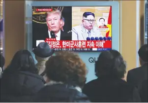  ?? AP PHOTO ?? People watch a TV screen showing North Korean leader Kim Jong Un and U.S. President Donald Trump, left, at the Seoul Railway Station in Seoul, South Korea, Friday.