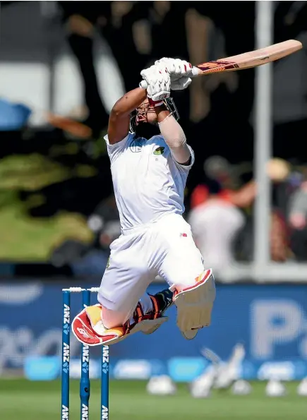  ?? PHOTO: PHOTOSPORT ?? South African batsman Temba Bavuma gets airborne as he plays a shot during his innings of 89 on the second day of the second test.