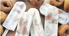  ??  ?? The PNE has offered dozens of outrageous new food items, including bacon cotton candy, deep-fried coffee and mini-doughnut Popsicles.