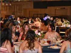  ?? PHOTO CORISSA IBARRA ?? Students from Brawley Union High SchooL enjoy their dinner at American Legion Post #60 while they await announceme­nt of the prom queen and king.