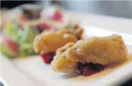  ??  ?? Buzzards’ Battered Balls are prairie oysters battered in cornmeal and finished with apple raspberry chutney.