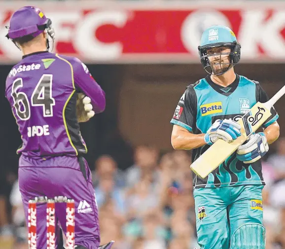  ?? Picture: AAP ?? ON YOUR WAY: Hurricanes ’keeper Matthew Wade (left) watches as Heat batsman Alex Ross is dismissed for obstructin­g the field.