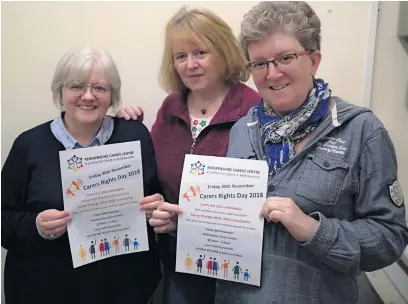  ??  ?? Helping hand Carers Maureen Reid and Trisha Forbes with group worker Margaret Campbell