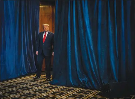  ?? DOUG MILLS / THE NEW YORK TIMES FILE (2020) ?? Then-president Donald Trump waits offstage before speaking Oct. 28 at the Trump Internatio­nal Hotel Las Vegas. A group of academics gathered to write a scholarly history of the Trump administra­tion — it will be published next year by Princeton University Press in a volume called “The Presidency of Donald J. Trump: A First Historical Assessment.”