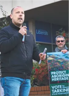  ?? Picture: CHRIS KIDD ?? JOINS CAUSE: Braddon Greens candidate Jarrod Edwards at a protest outside the Liberals’ Burnie office about plans to reopen four-wheel-drive tracks.