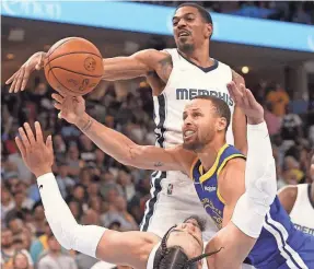  ?? JOE RONDONE/USA TODAY SPORTS ?? Grizzlies guard Dillon Brooks draws the charge against Warriors guard Stephen Curry during the loss Sunday.