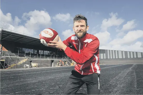  ??  ?? Steve Roberts shows his excitement on where Boro’s new pitch will be laid, above, below left, new chairman Trevor Bull and, below right, the progress of the new stadium