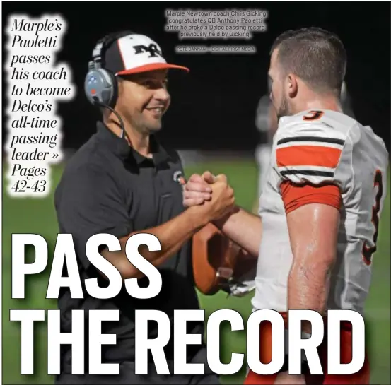 ?? PETE BANNAN — DIGITAL FIRST MEDIA ?? Marple Newtown coach Chris Gicking congratula­tes QB Anthony Paoletti after he broke a Delco passing record previously held by Gicking.